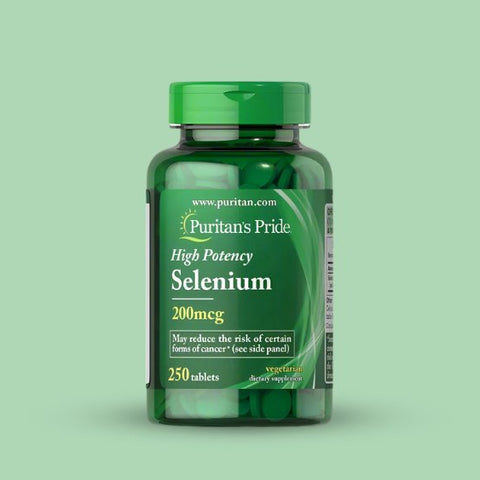 Green bottle of Puritan's Pride High Potency Selenium supplement on a light green background